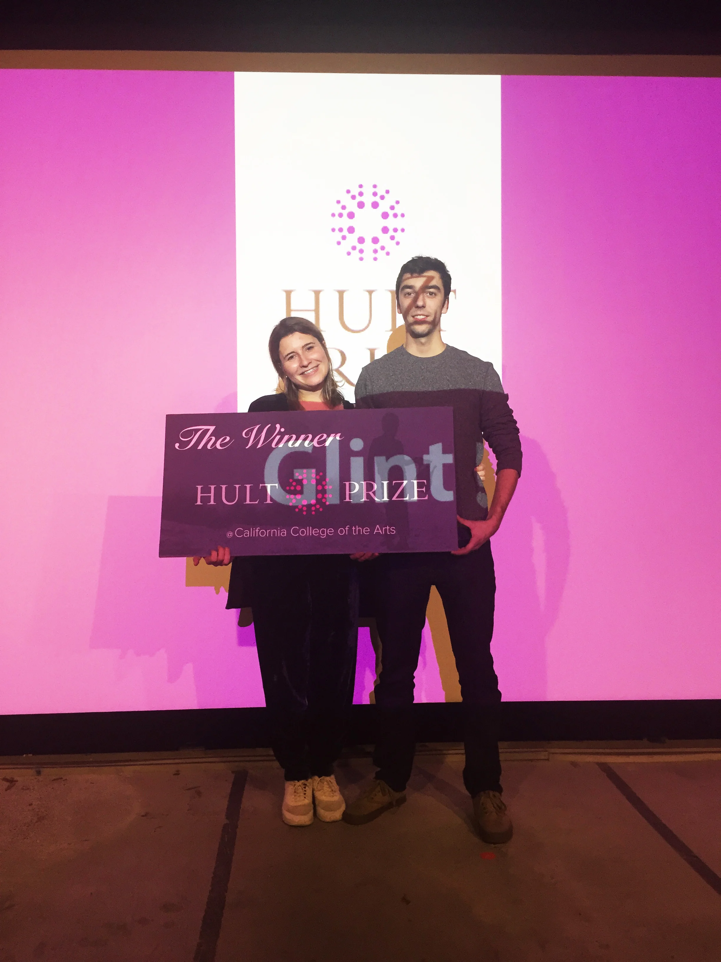 Tim and Sophie happy after a successful presentation.