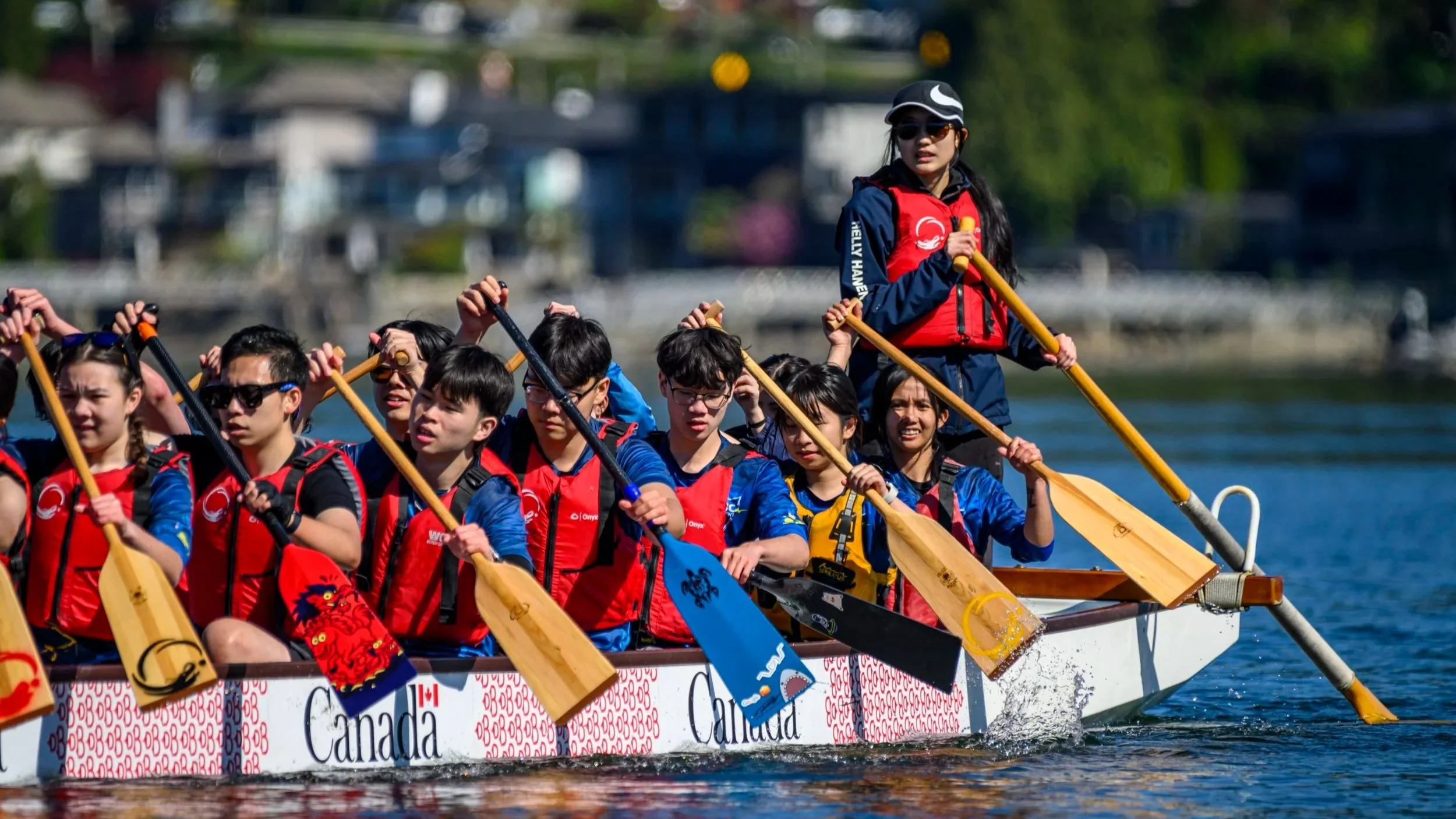 Youth team with paddles up