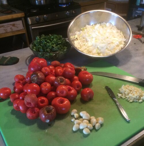 All from the garden! Tomatoes, onions, soup celery and garlic ready to be made into stewed tomatoes.