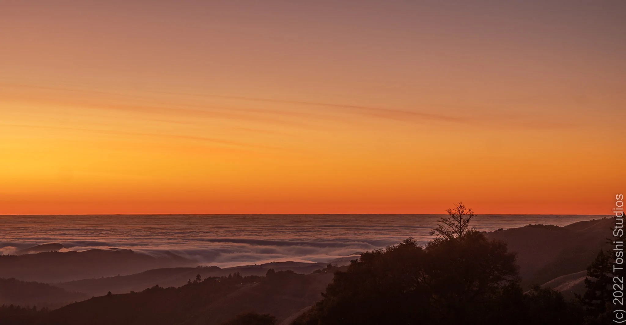 Sunset above the SF Bay clouds