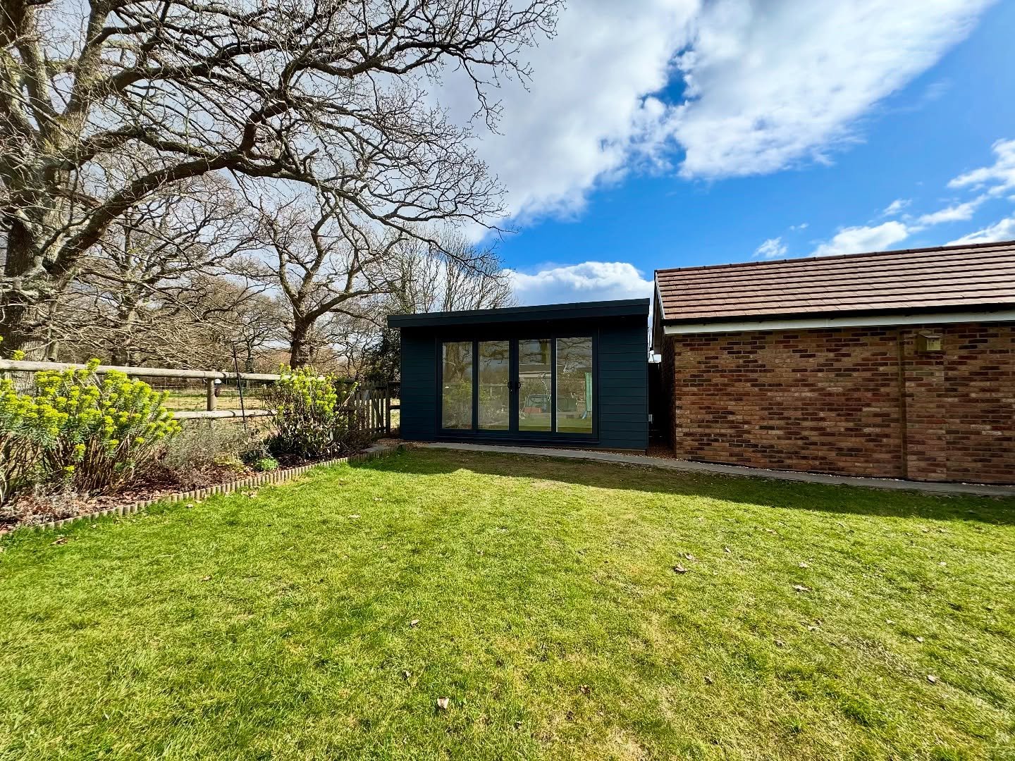 We completed this room this week in Verwood, Dorset, looks great in Anthracite Grey. Inline Patio Doors, internet and WiFi connected air conditioning. #gardenroom #gardenbuilding #gardenstudio #gardenoffice #gardengym