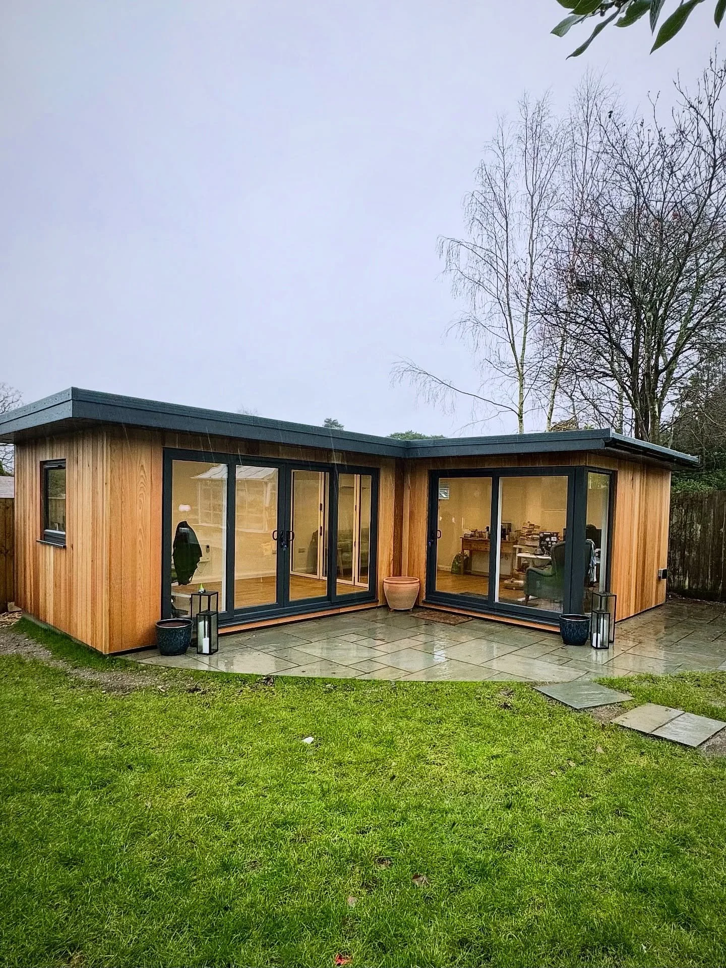 Not the best week for photos.
We have completed this L Shape Garden Room, in Chandlers Ford. Primarily to be used as office space the rooms are divided by internal bifold doors. Finished in Cedar, with Air Conditioning and Internet. #gardenroom #gard