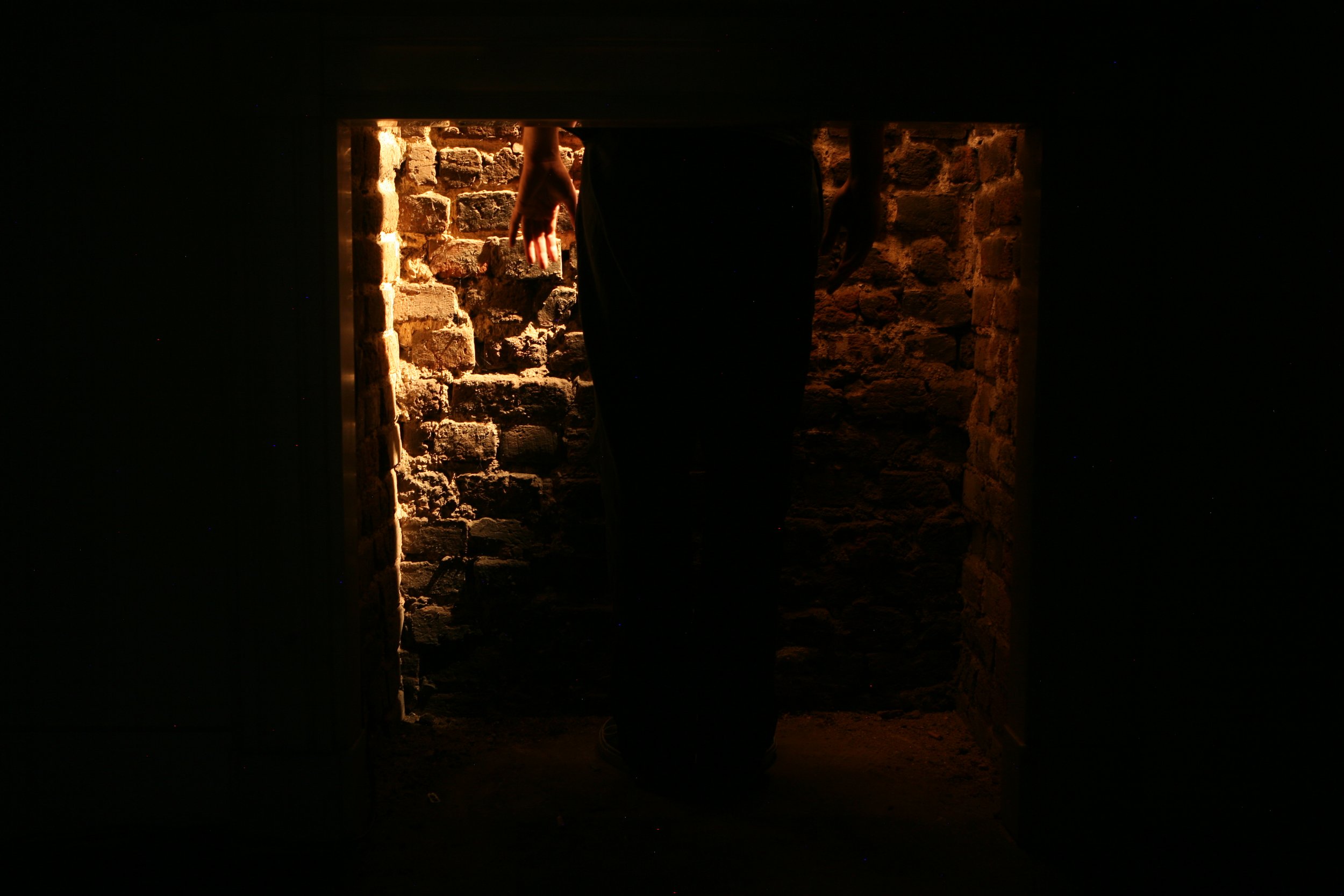 Fire Place is a site specific installation whcih invites the viewer to step into a large fireplace where a light slowly pulses and the sound of an intense fire plays