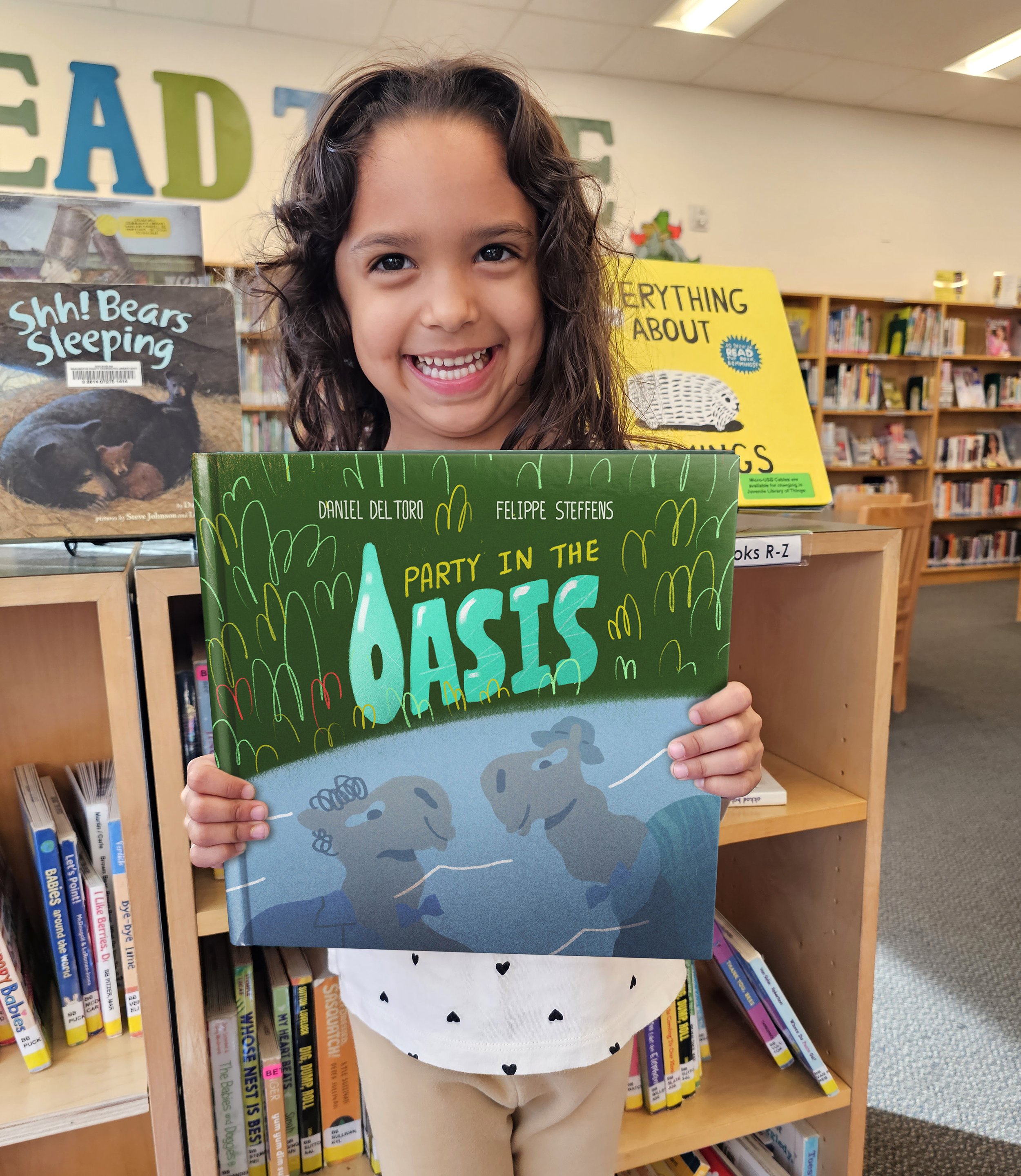 nina holding oasis book copy2.jpg