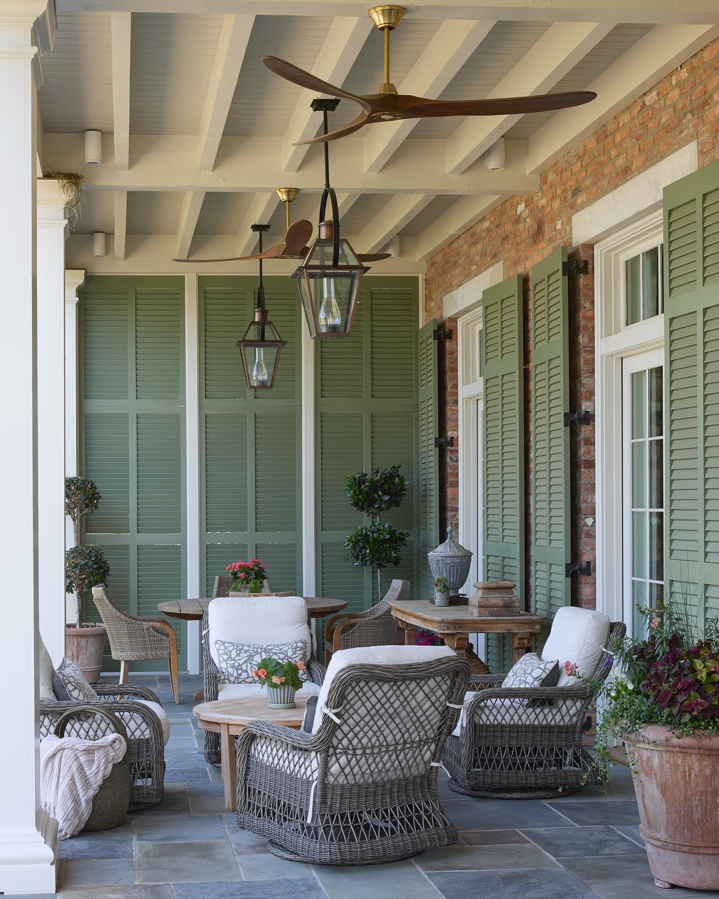Mid-day shade on the comfortable porch of a French Colonial home
.
.
Architecture: @carlislemoorearchitects 
Construction: @walkerandwhitebuildersllc 
Landscape: @troyrhone 
.
.
#architect #residentialdesign #home #frenchcolonialarchitecture #porch #