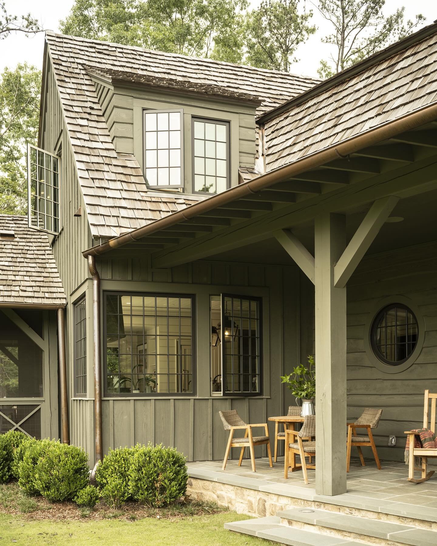 A porch created for sitting.  An important part of designing this home was providing as many connection points with the incredible property as possible. Capturing landscape views through expansive windows was as much a goal as was creating a variety 