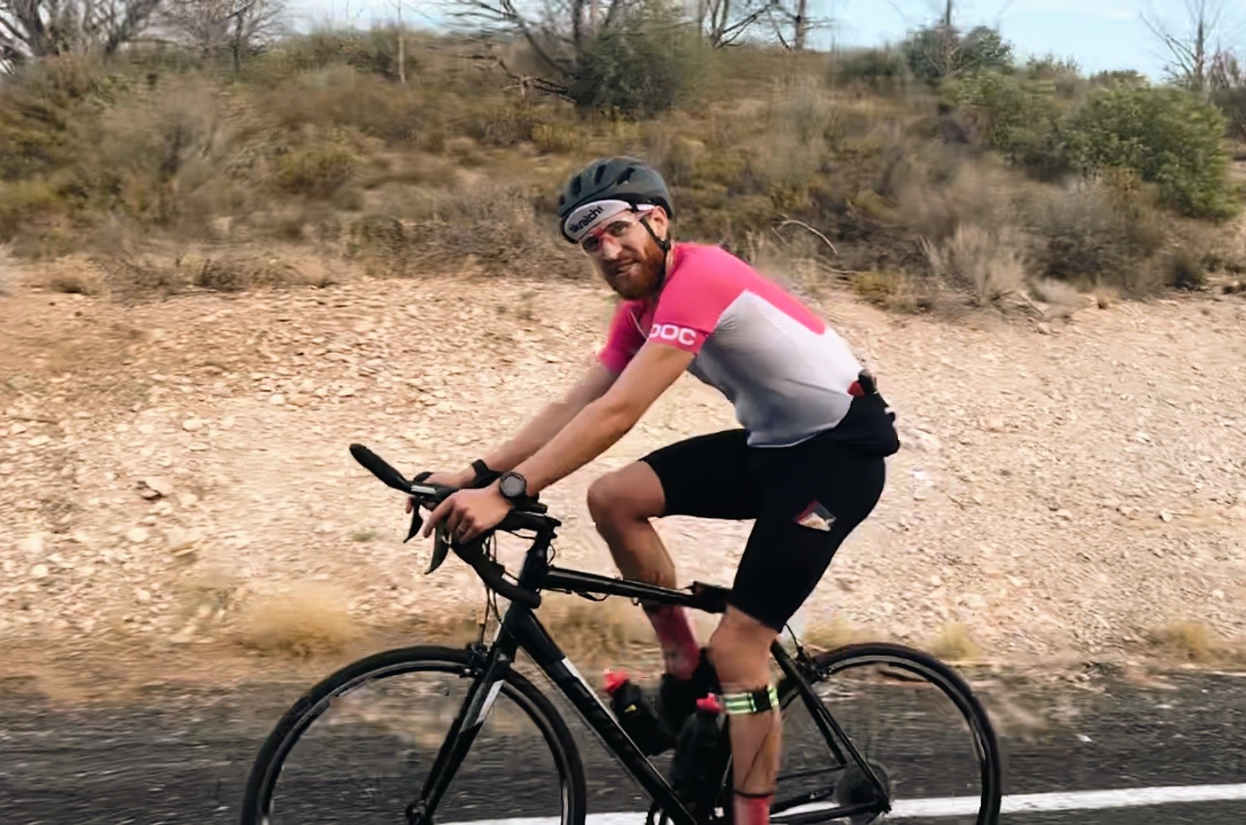 Cyclist Lee Hanyo on bike climbing up Utah Hill during Saints to Sinners bike race