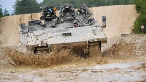 Army halts use of Ajax vehicles after soldiers fall ill. The Ministry of Defence has paused rollout after multiple reports of hearing loss, nausea, and other illnesses among crew members. Defence officials confirm an urgent review is underway as conc