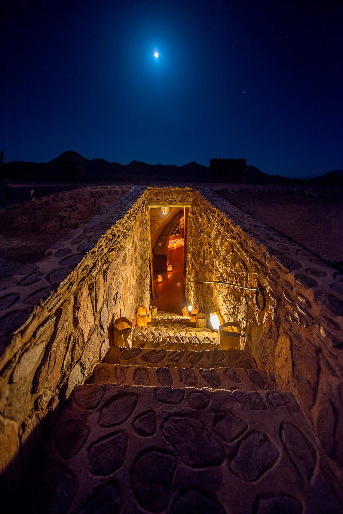 A full moon rises over the stairs leading to Le Mirage's wine cellar.