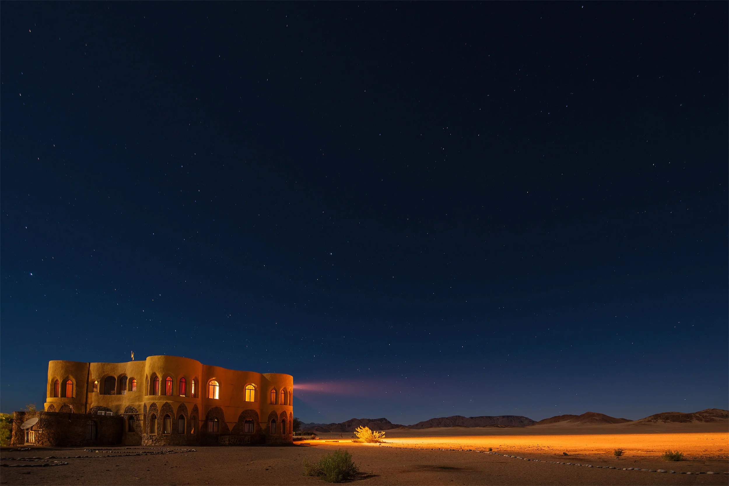 The faint lights of Le Mirage first appeared when we crested a rise a few kilometers out. After a long stressful drive, it was a beacon in the night.
