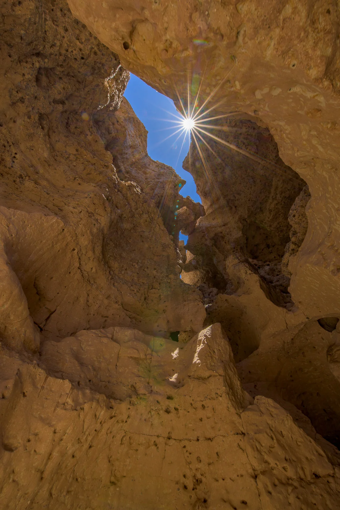 Peering up at the head of Sesriem Canyon.