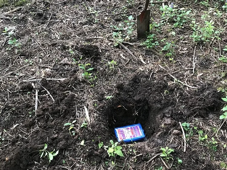 I buried the box (tied up and in a ziploc bag) in a hole in this little wooded area. I saved the lat./long. coordinates with a plan to return in 25 years and share it with whoever lives in the house (if it’s different from my parents, and if the res…