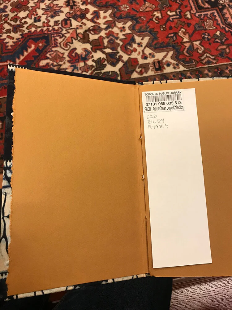 There is an overwhelming amount of amazing finds in the room. In addition to old novels, early detective tradebacks, and all manner of beautiful books that have connection to Doyle, there are also numerous artist books printed and bound by hand with…