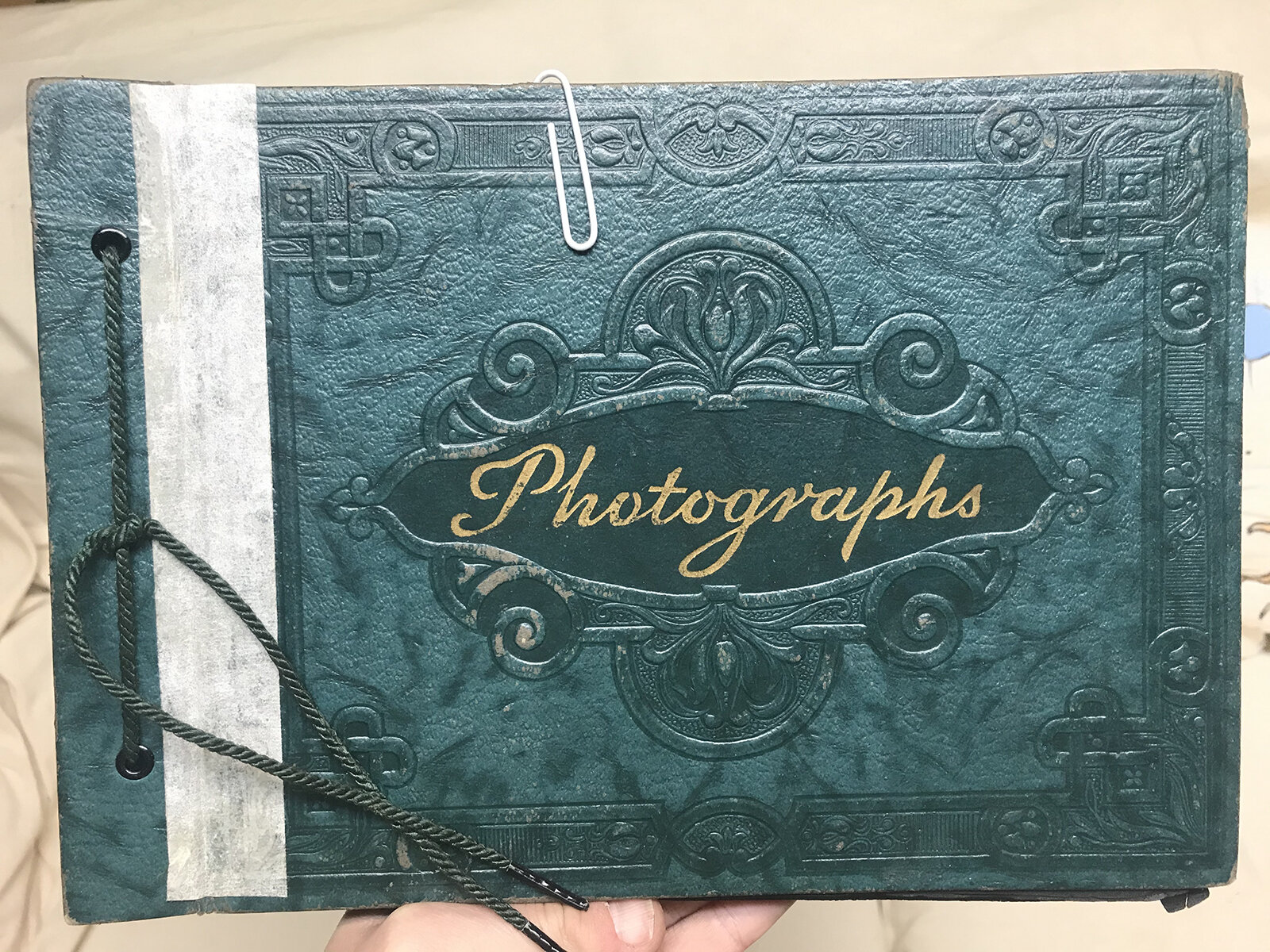This was the photo album I was originally searching for in the basement. It is the kind of album with paper pages, that still has photo corners stuck on the inside where photographs used to sit. The photographs were taken out for the scanning/archiv…