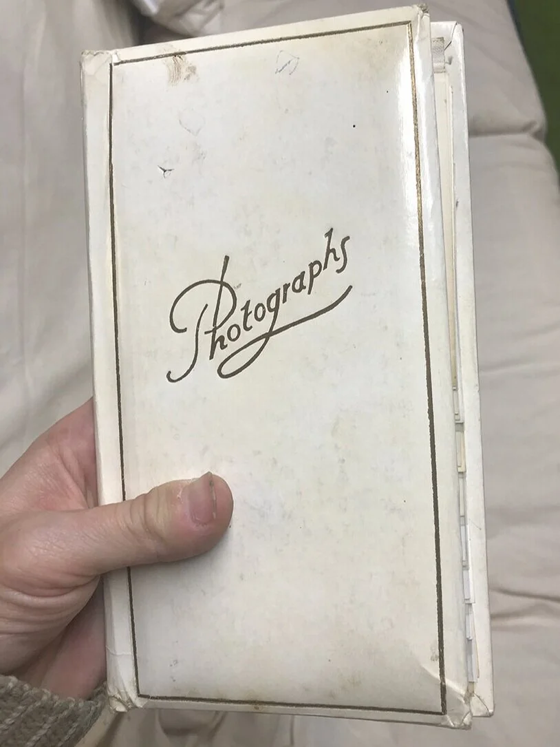 And this is the outside of the found album. The corners are a bit worn, with paper coming up, fingerprints, smudges, and some pen marks. Still in decent shape, however.