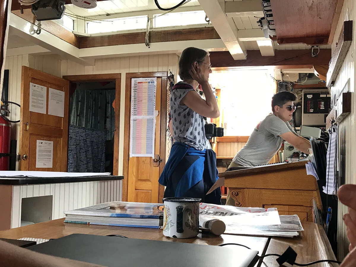 The pilot house of the S/V Denis Sullivan. This photograph was taken while docked in the Welland Canal after leaving Toronto a few days before; we had just arrived with the ships Pride of Baltimore II and Bluenose II, and myself and only two others …