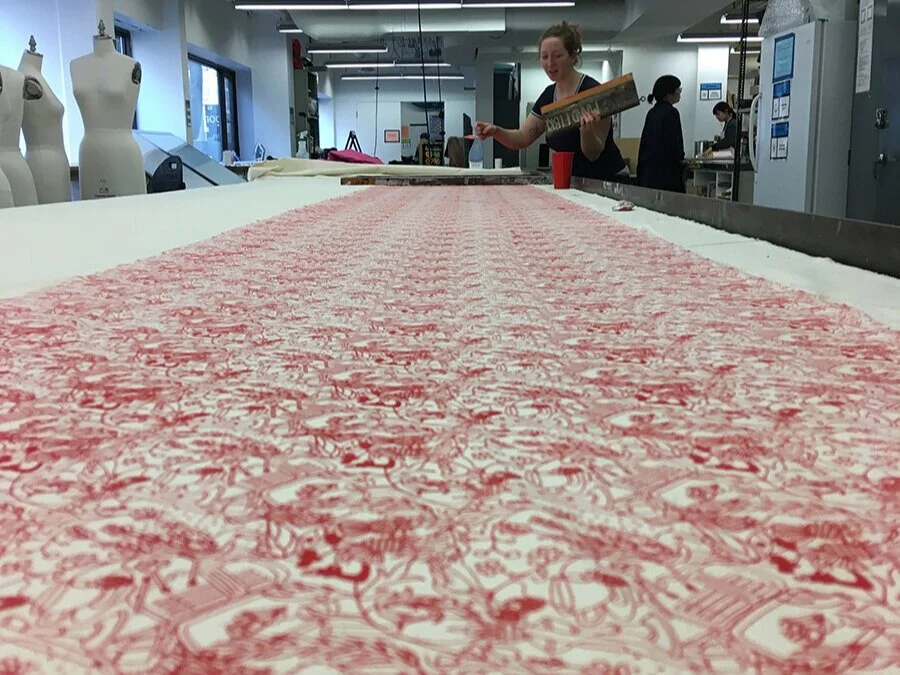 After printing on paper at the printmaking studio, I spoke with the technician in the MAAD textile studio to see if I could use the tables for printing yardage. The studio is very organized, and has sign up sheets for everything. I set aside an enti…