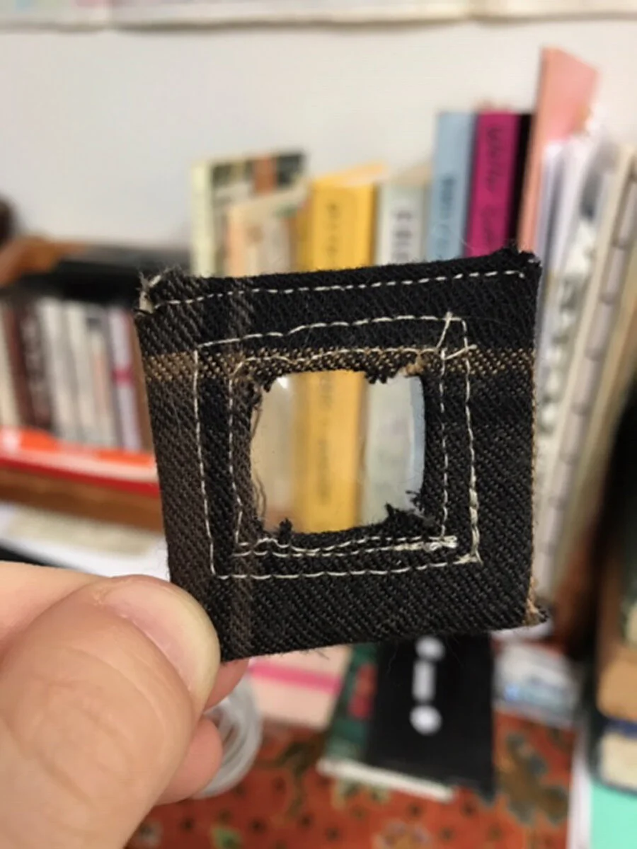 I also spent some time creating the secret pockets, which were fit specifically to objects I planned to carry with me in the coat. This little window pocket, about 2x2” was made with a clear acetate window to hold a hollow coin that itself holds a f…