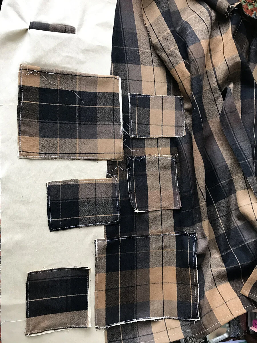 I began to layout where to place the pockets, which was something of a puzzle. I wanted to balance overall future weight (so I wouldn’t carry all heavy items on one side only), and size, but still wanted to align the lines of the plaid pattern, as b…