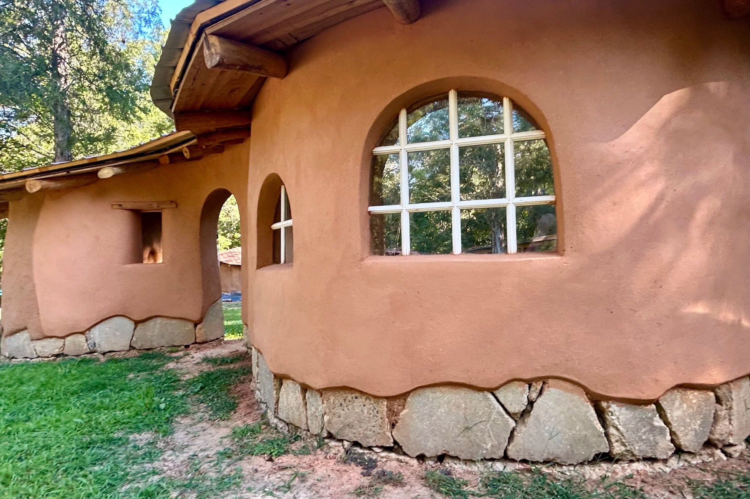  Cob wall on campus, with a base coat of clay plaster 
