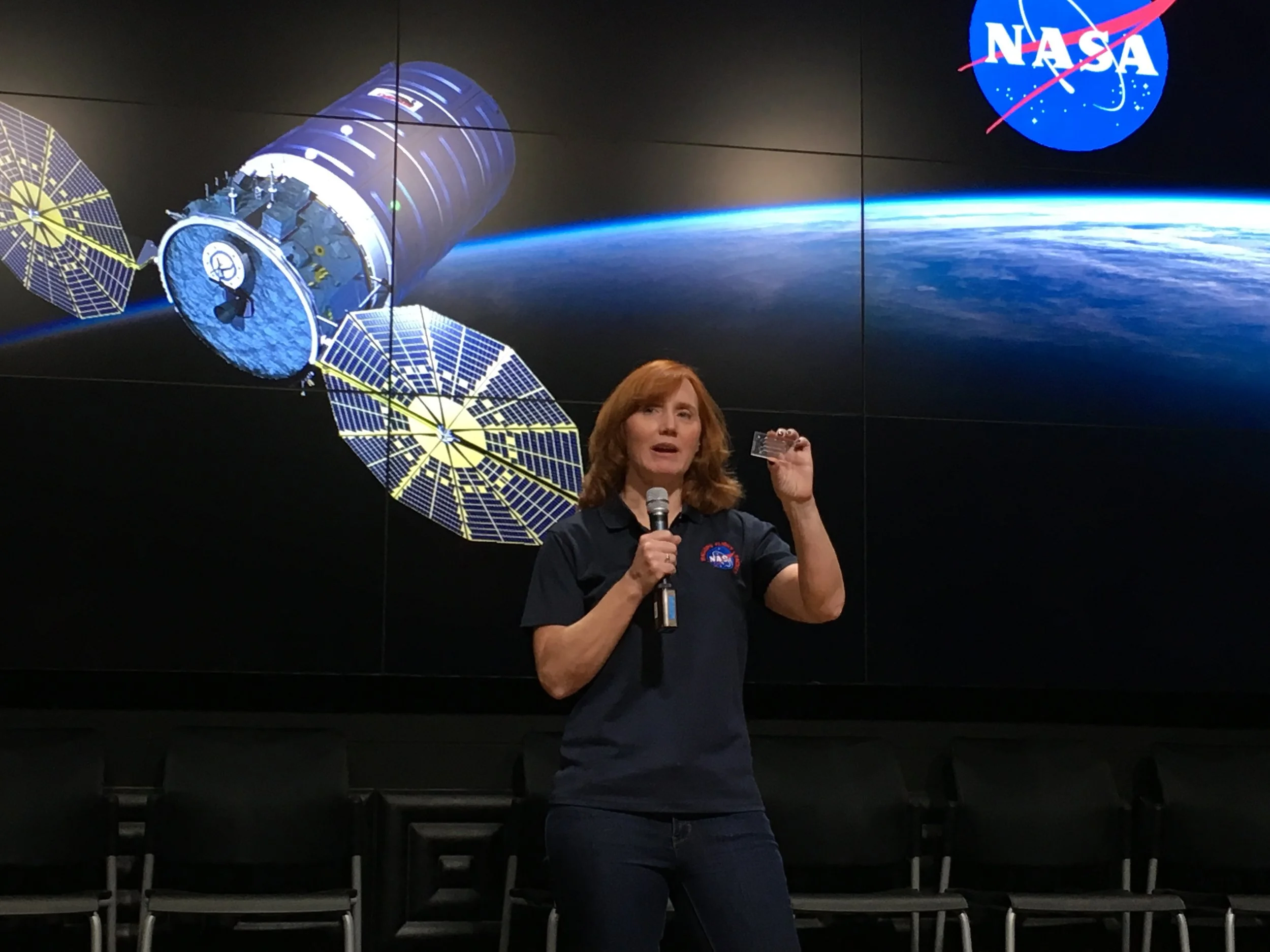 Siobhan Malany holds a mockup of the “lab-on-a-chip” device carrying her research to the ISS.