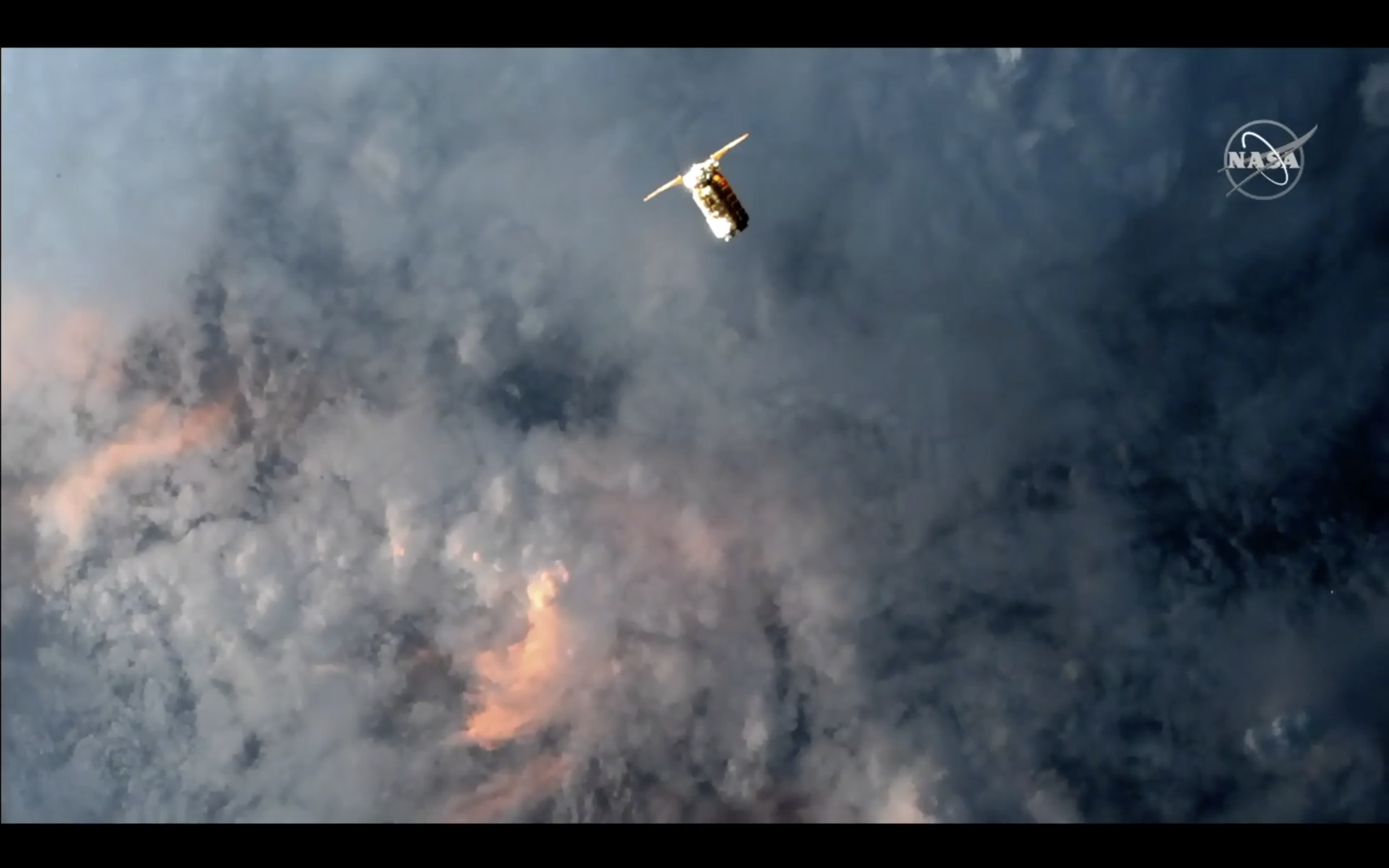 The Cygnus spacecraft stationkeeping 250 meters from the ISS during the rendezvous, just before crossing the terminator into nighttime. (Image: NASA TV)