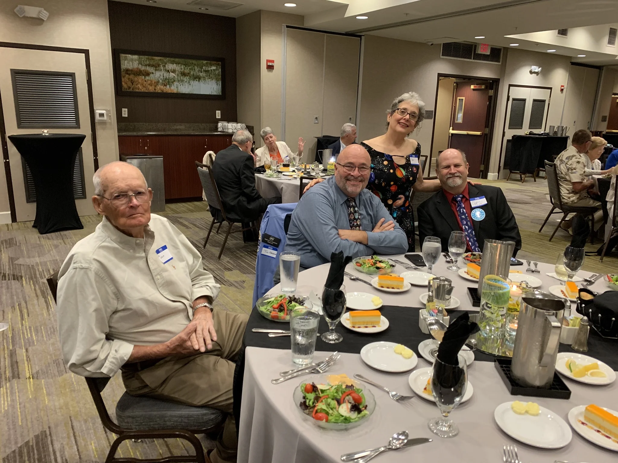 L-R: Former NASA pilot and USAF astronaut Al Crews, mission-patch artist Tim Gagnon, and spaceflight communicators Beverly Rother and Chris Boyd ready for an exciting panel! (Photo: Space Pioneers)