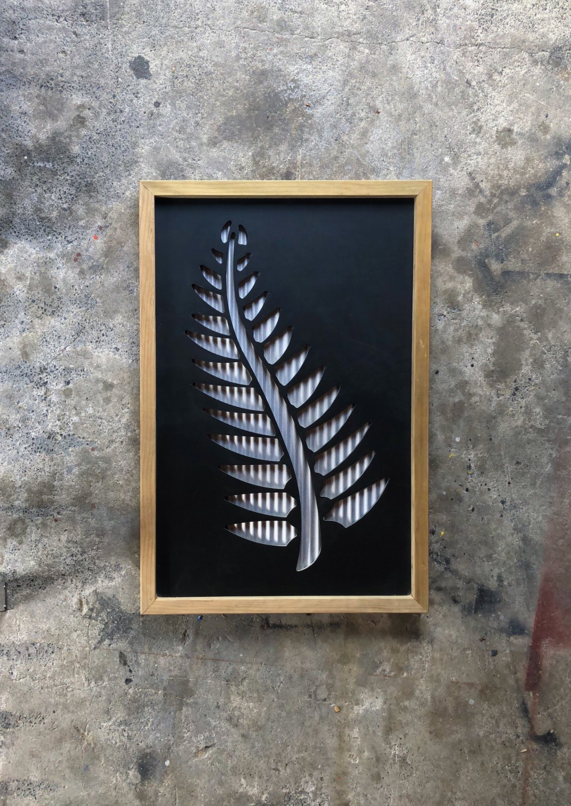 black-painted-framed-cnc-silver-fern-with-zincalume-backing.jpg