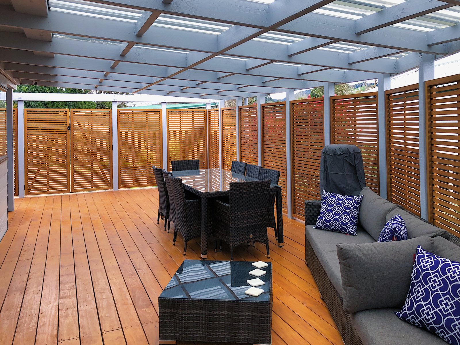 stained-installed-oriental-framed-trellis-panels-deck-surround.jpg