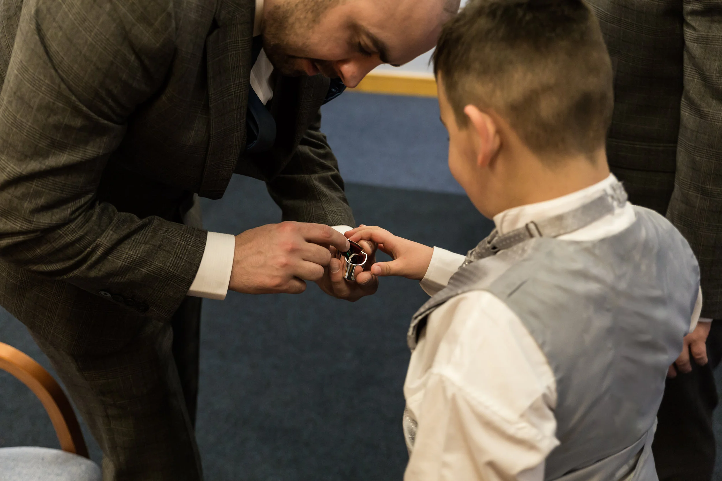 Ring bearer and the best man share a moment, at blackburn registry office