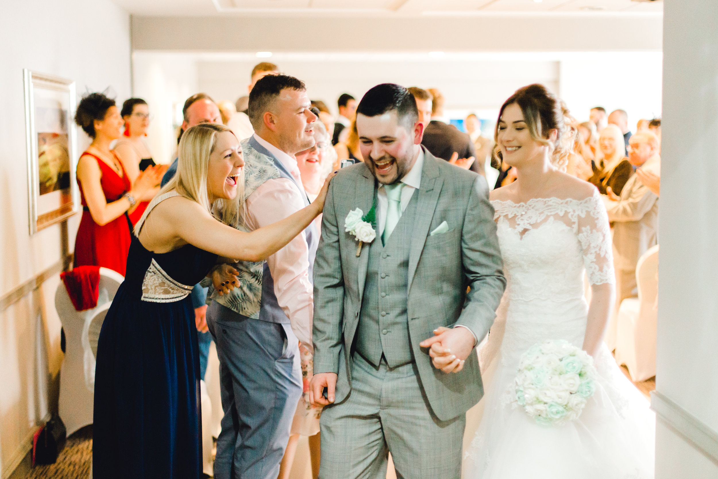 newly-wed bride and groom exiting ceremony