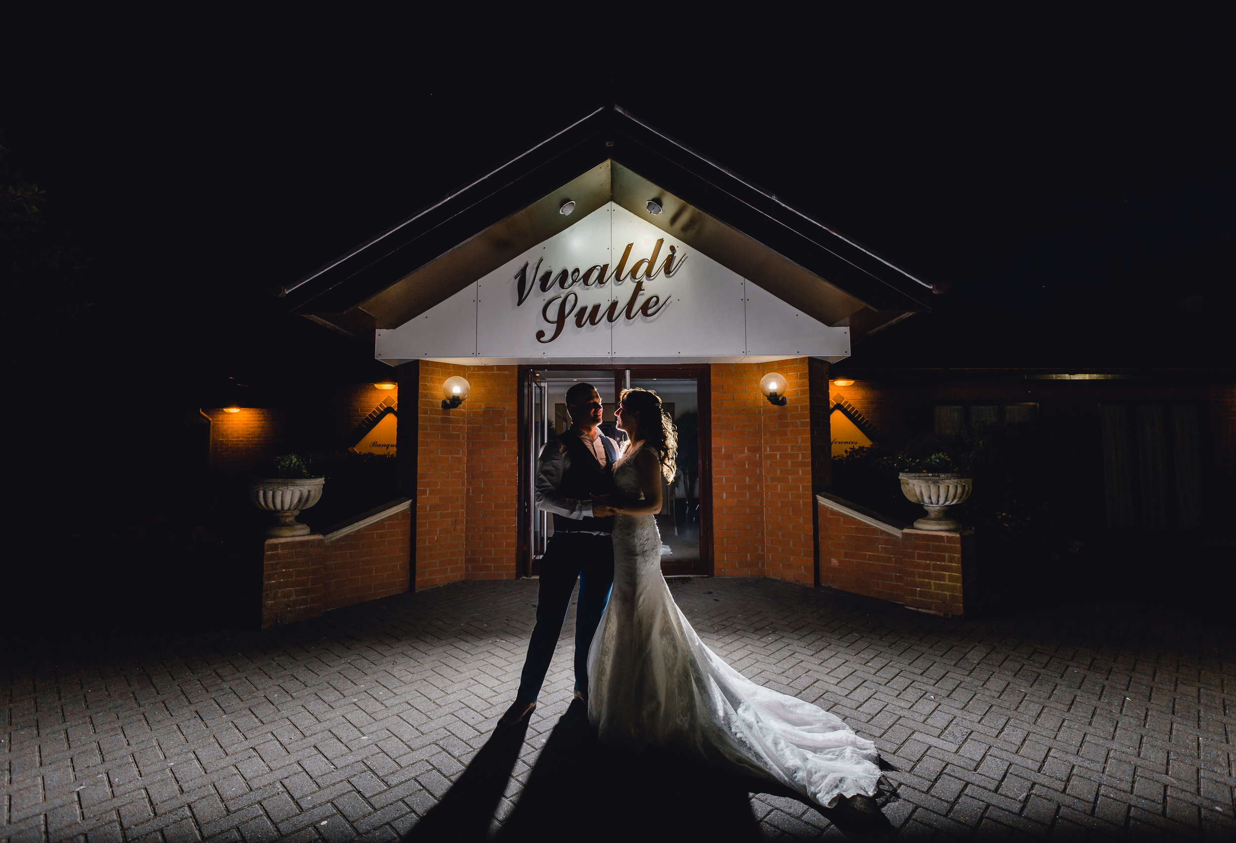 Creative night time portrait during wedding reception