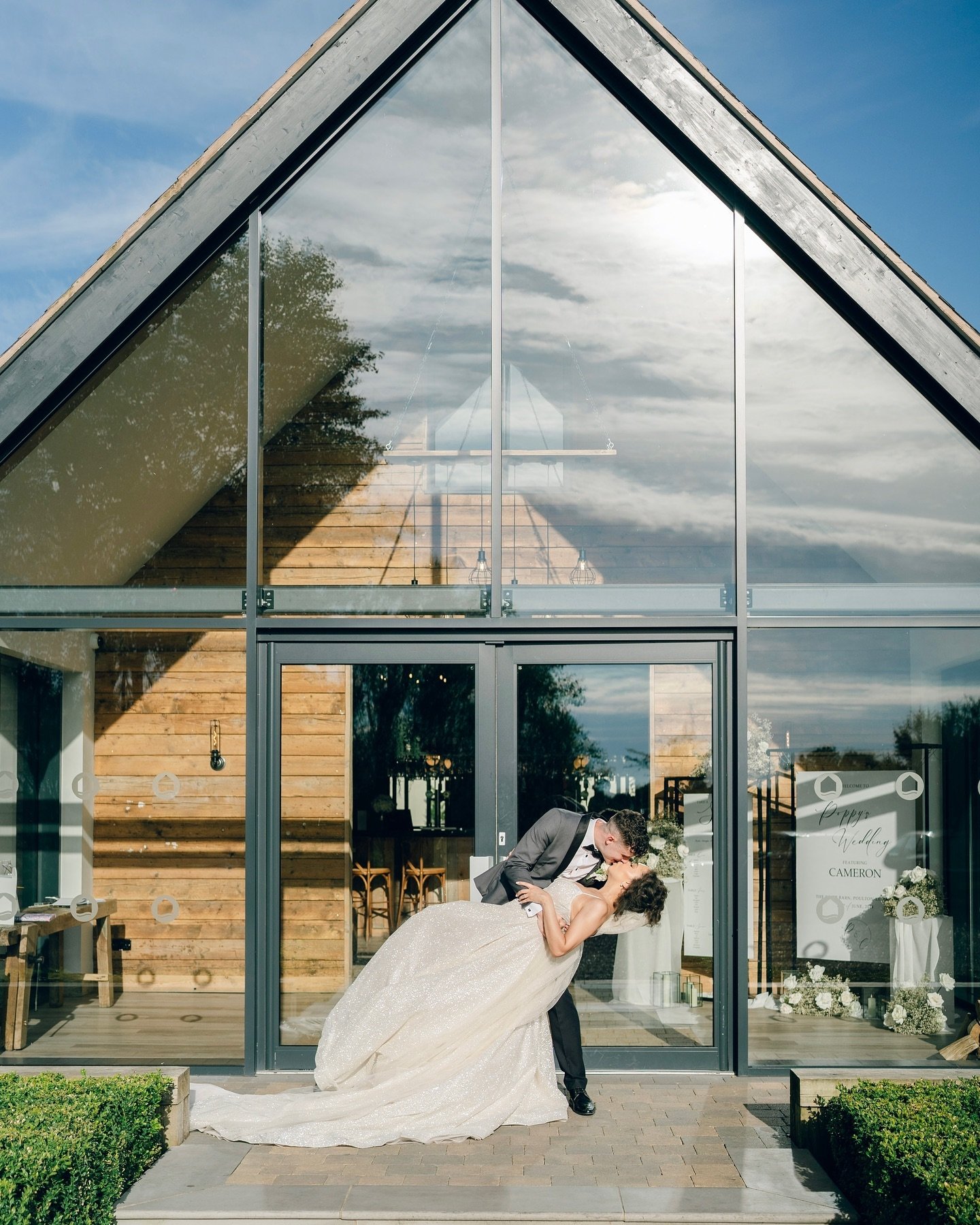 🤍poppy &amp; cameron 🤍

The iconic glass front of @riverbarnweddings makes an ace backdrop for this dip kiss shot👌🏻
.
.
.
#theriverbarn 
#riverbarnweddings 
#riverbarnweddingphotographer 
#lancashirewedding 
#lancashireweddingphotographer 
#2025w