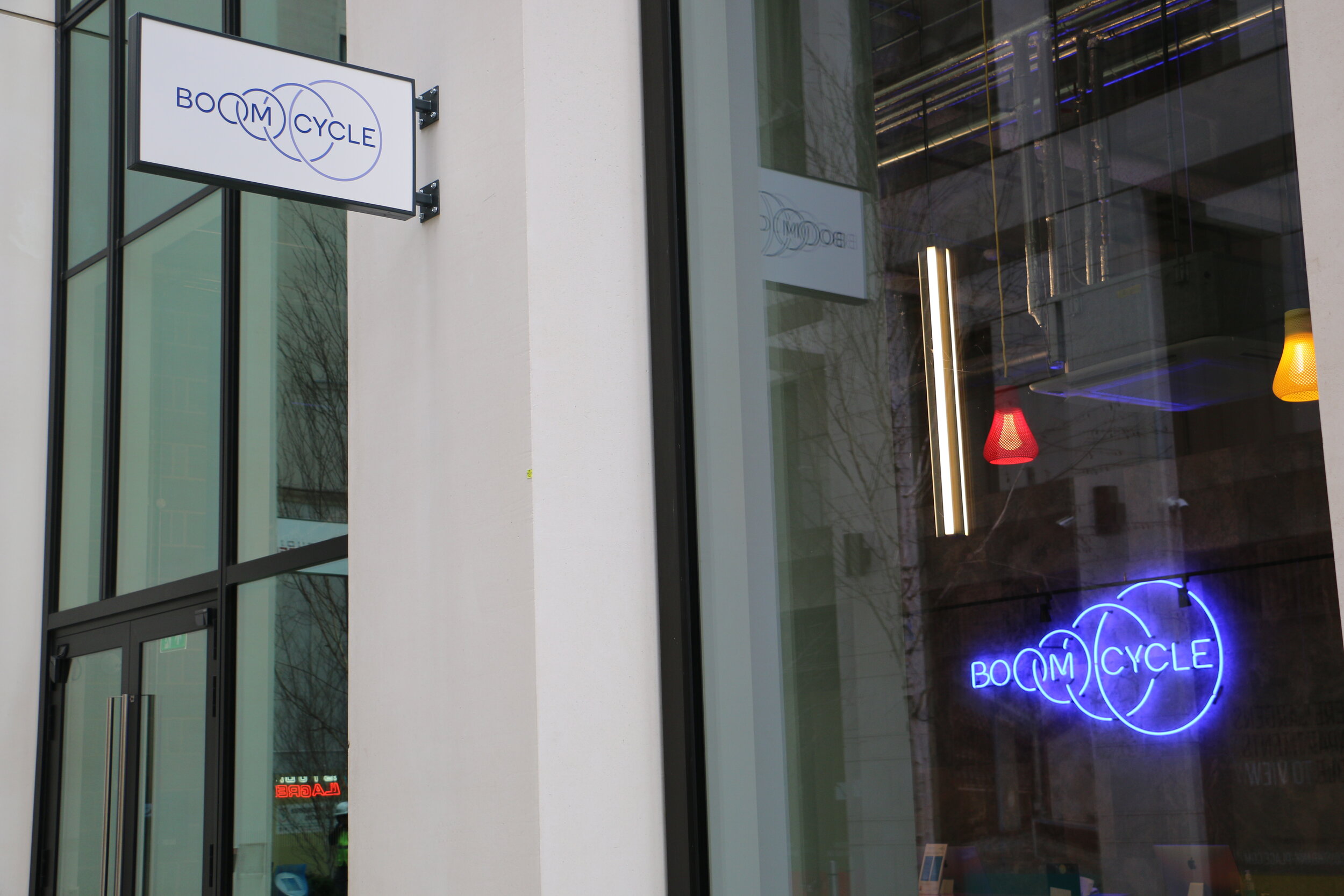 Boom Cycle Neon and Bus Stop Signage