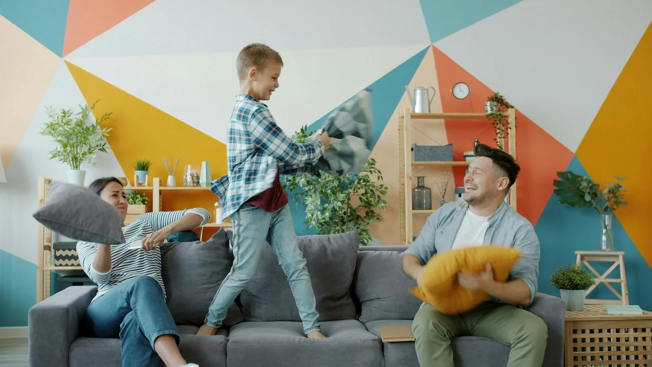 Family playing on the couch pilling Minneapolis Upholstery Cleaning