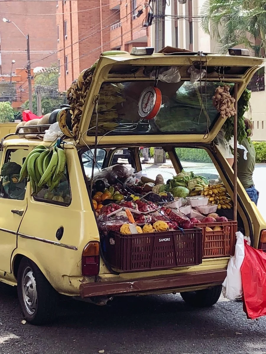 Fruit and produce sold from a car on a street in Medellín, Colombia