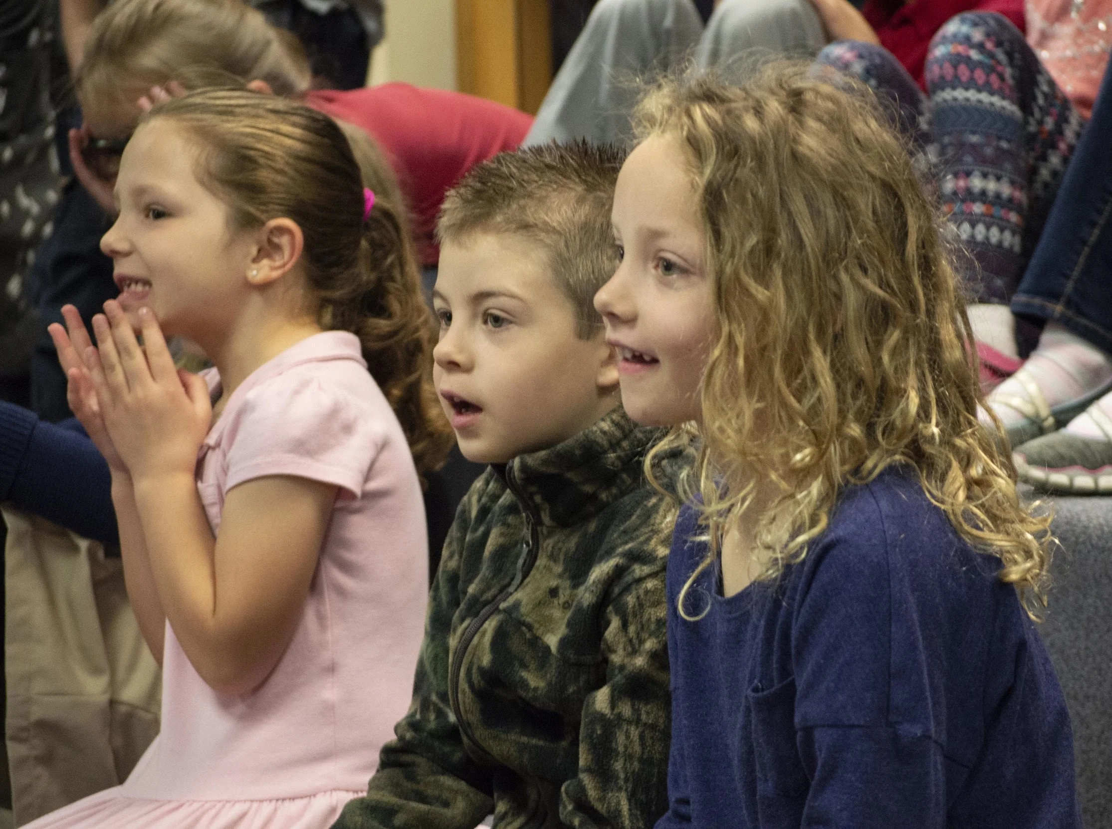 LCS Elementary students participate in a presentation in the library.