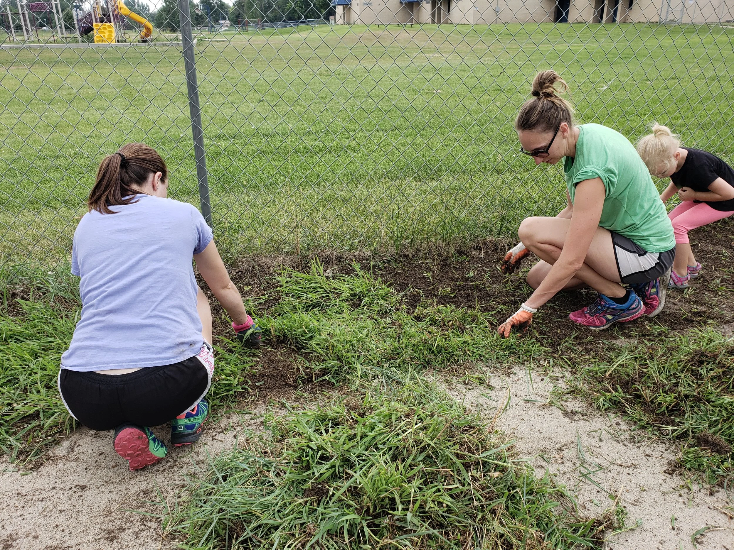 PTO members help at the Community Day clean-up.