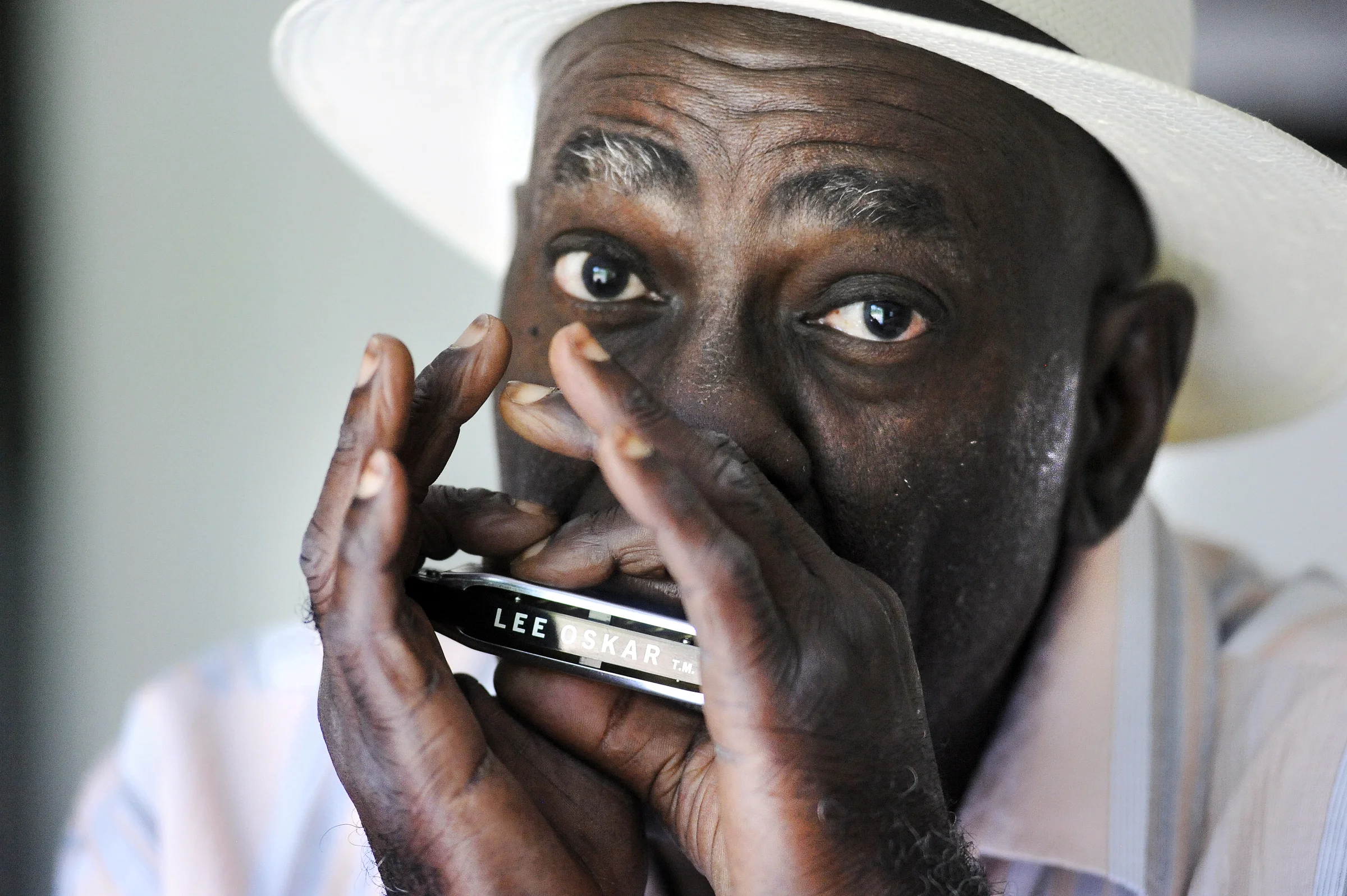  Blues musician, Rip Lee Pryor, plays the harmonica at his Carbondale, Illinois home. 