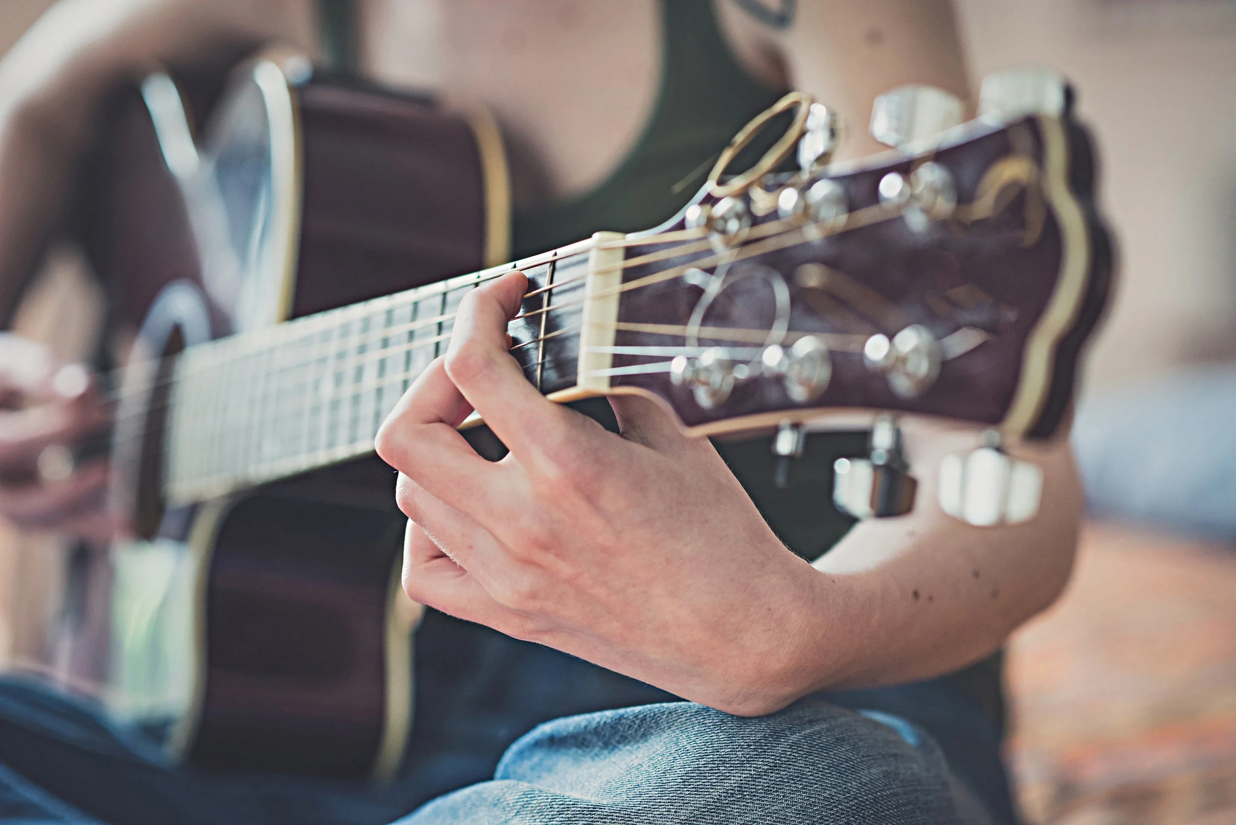 close-up-of-woman-hands-playing-guitar-PCTAPGK.jpg