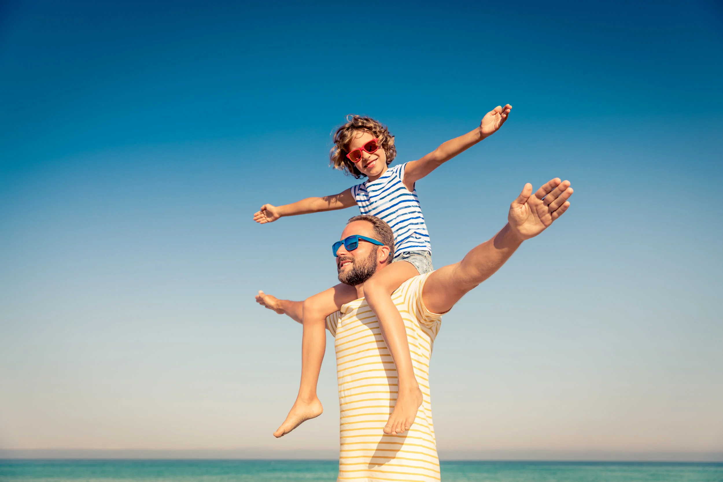 Dad on Beach_AdobeStock_252614949.jpeg