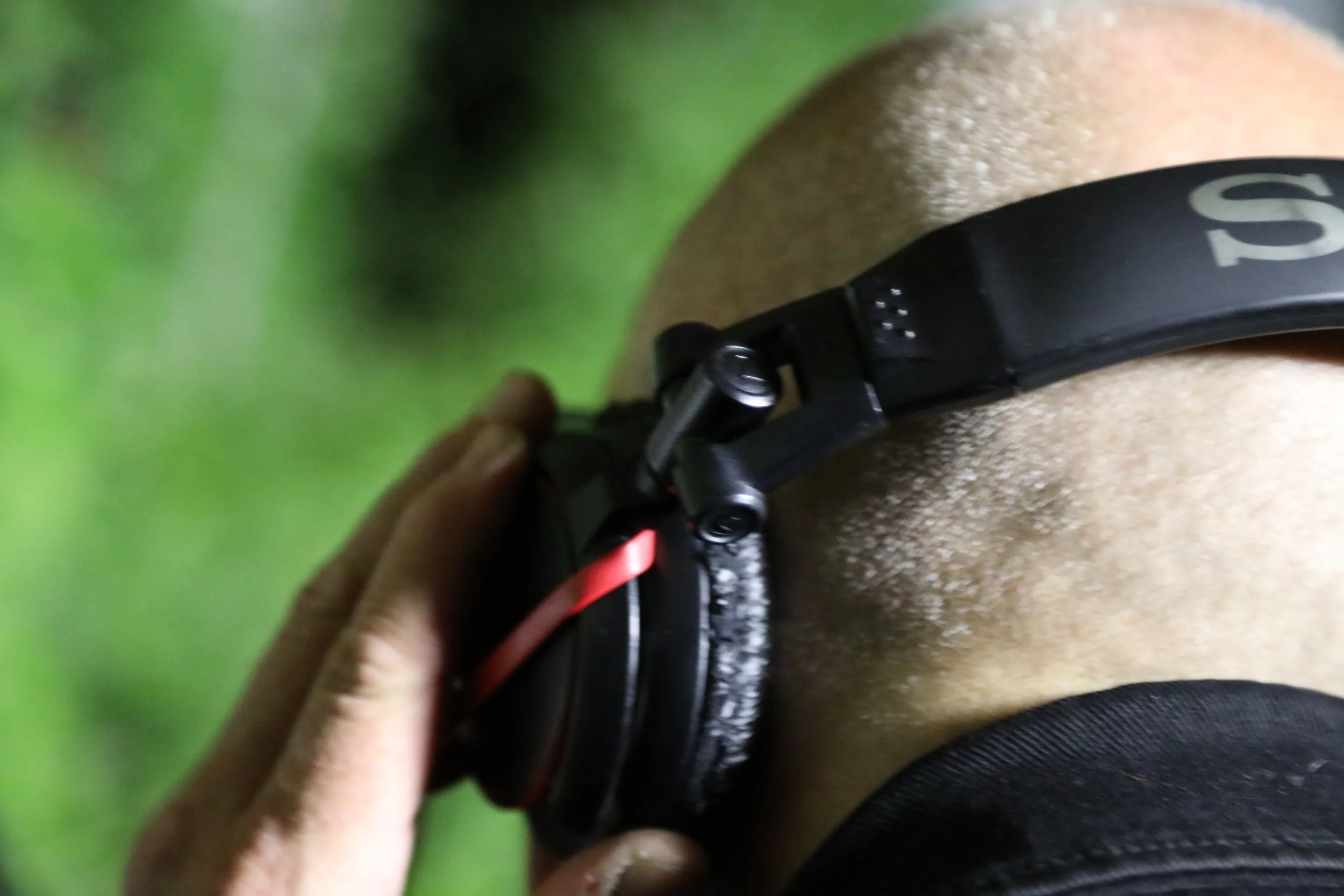 Close-up of a person's leg with a black fitness tracker on their ankle.