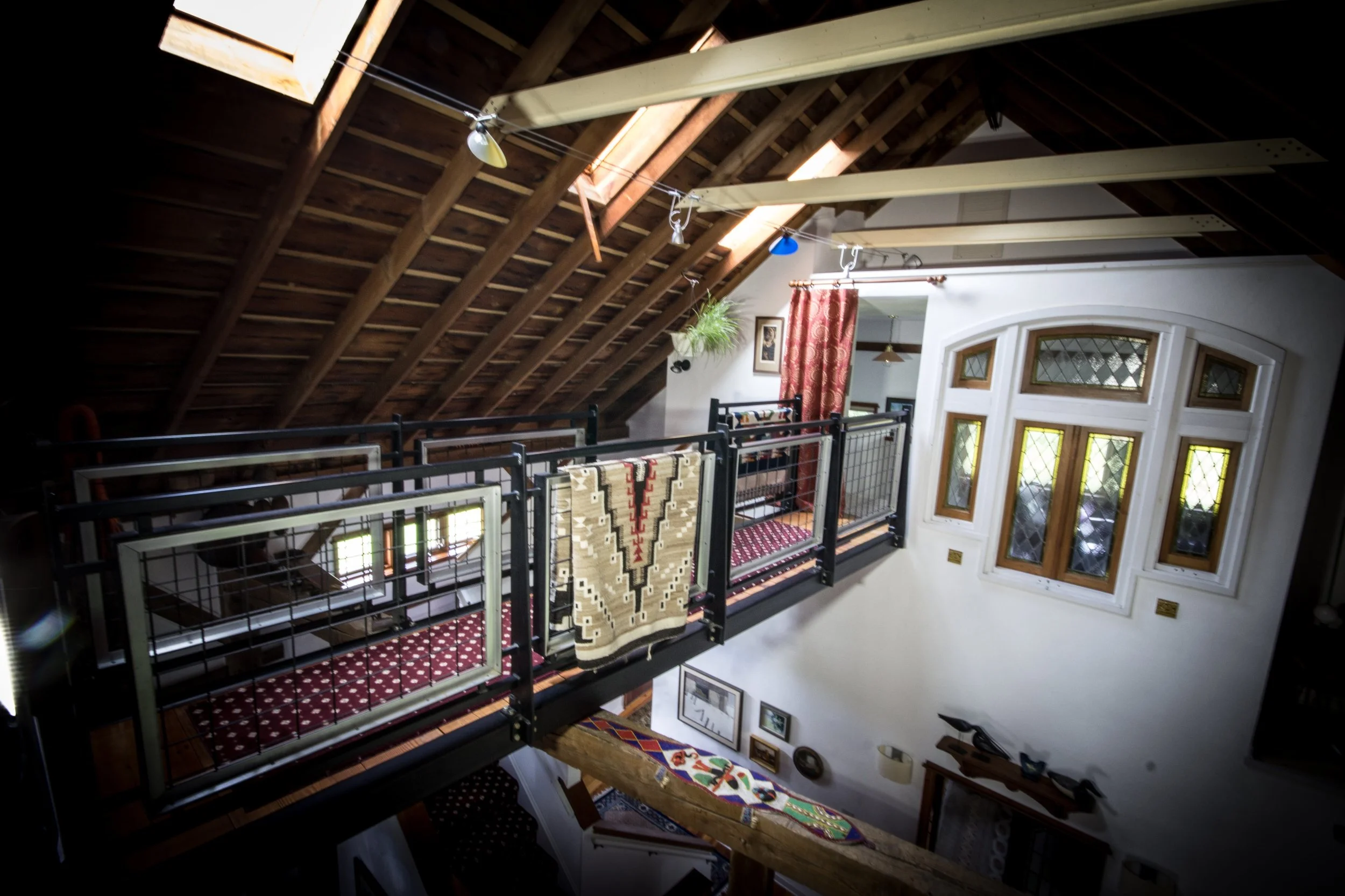 Elevated Bridge and Railings Connect 2 Loft Areas.