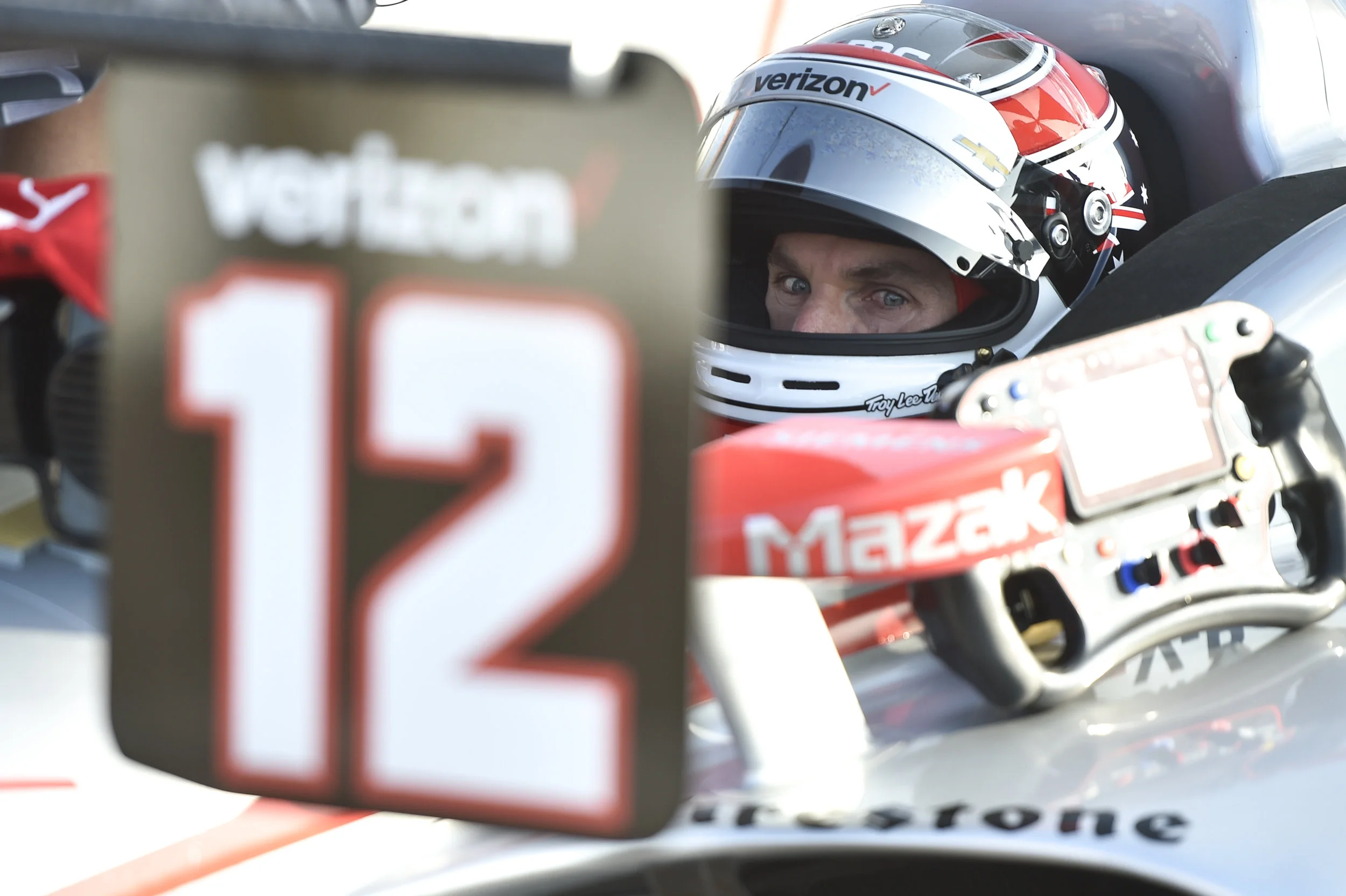 Will Power waits as his crew makes adjustments during practice.