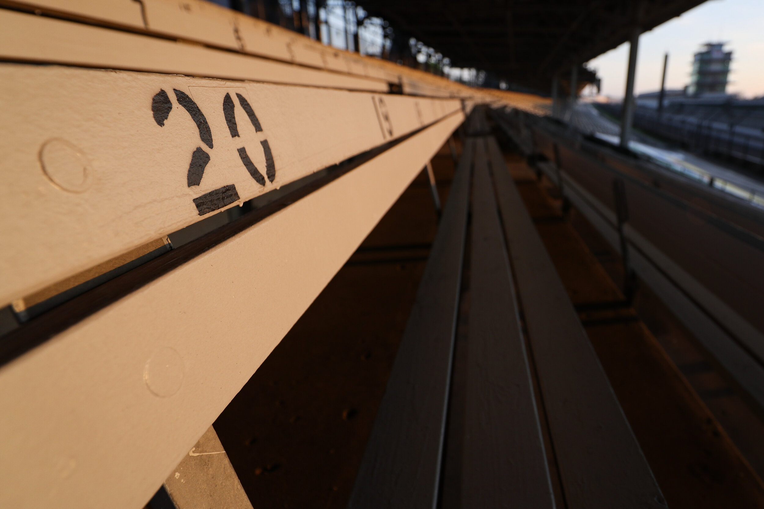 Race day morning, wooden bleachers. 