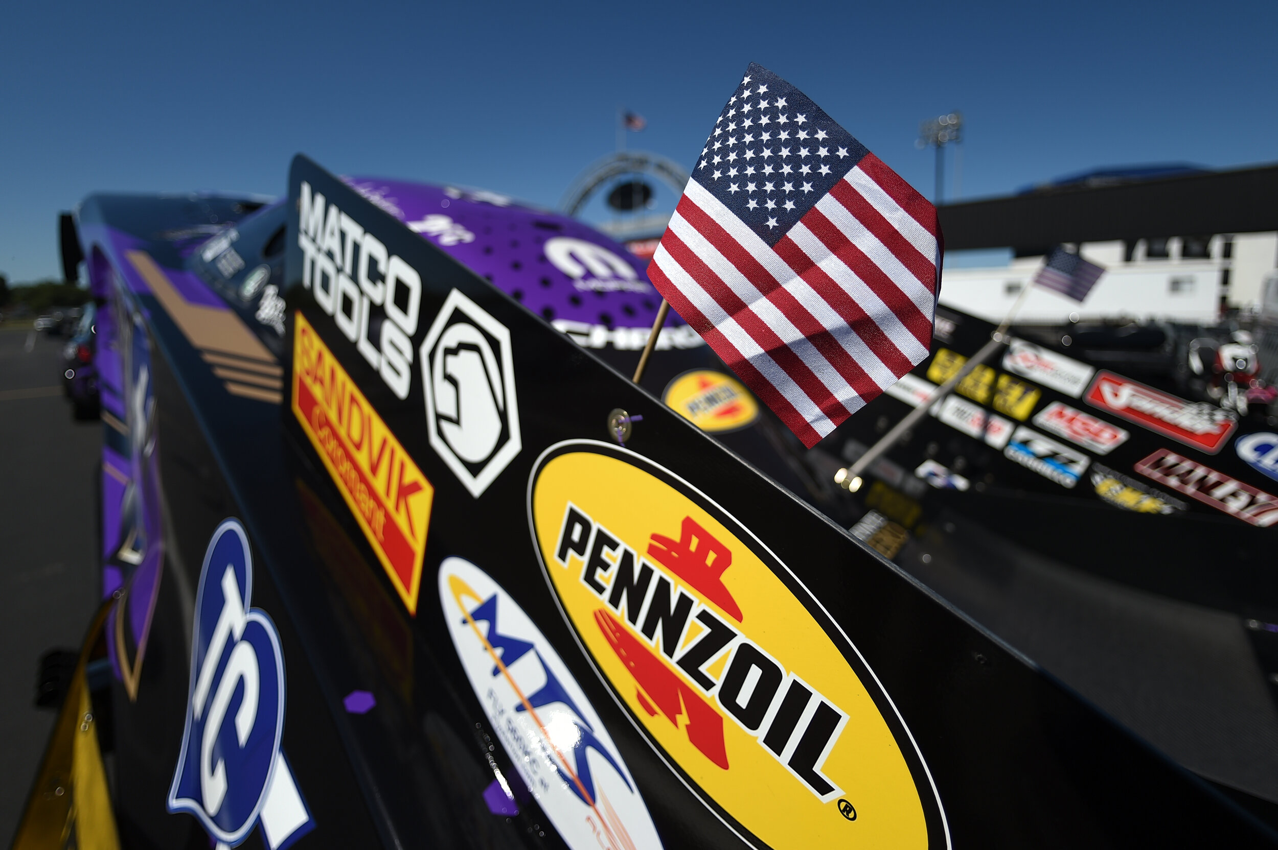 American flag on the wing of funnycar driver, Fast Jack Beckman.