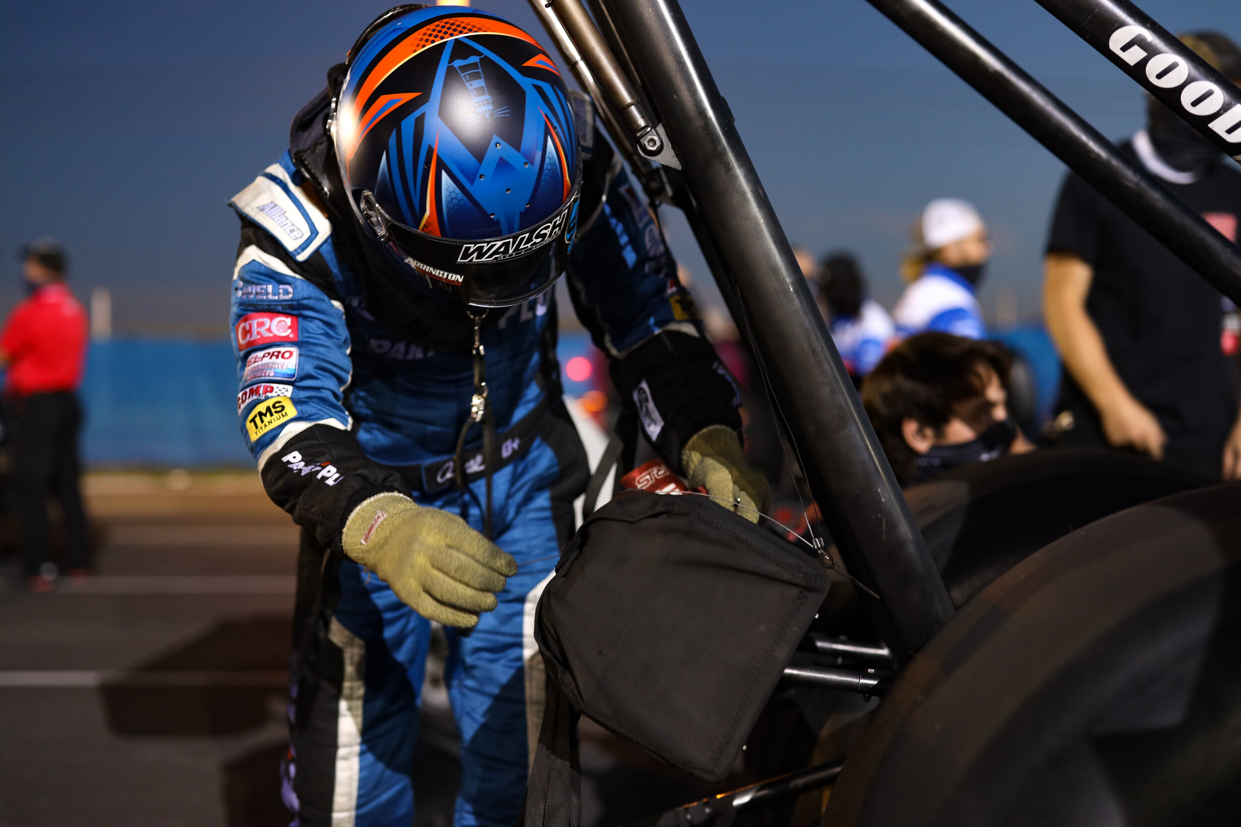 TF Dragster driver Clay Millican does a final check on his parachutes before his qualifying run.