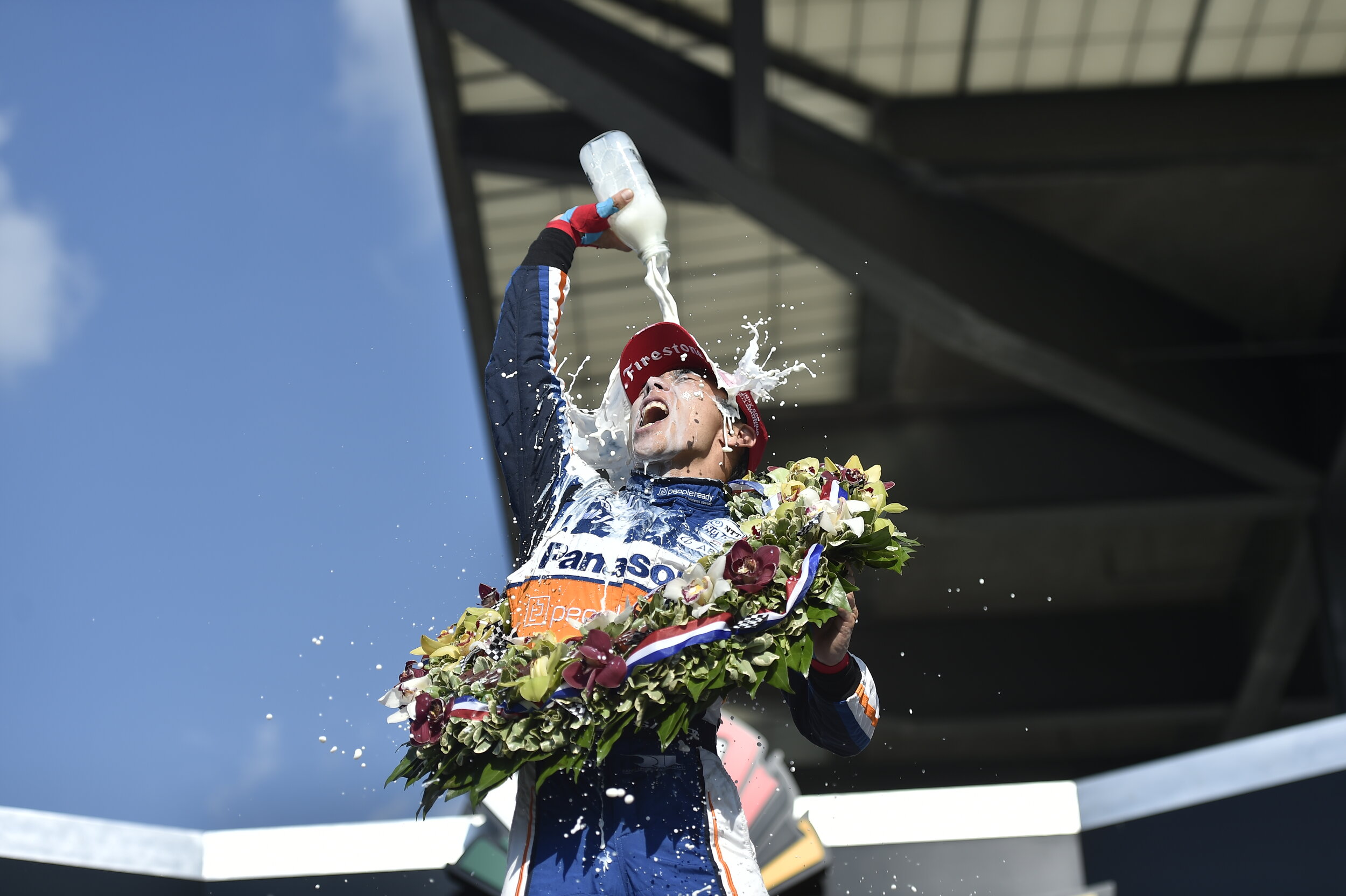  Takuma Sato cools off with victory milk after winning the 2020 Indianapolis 500. 