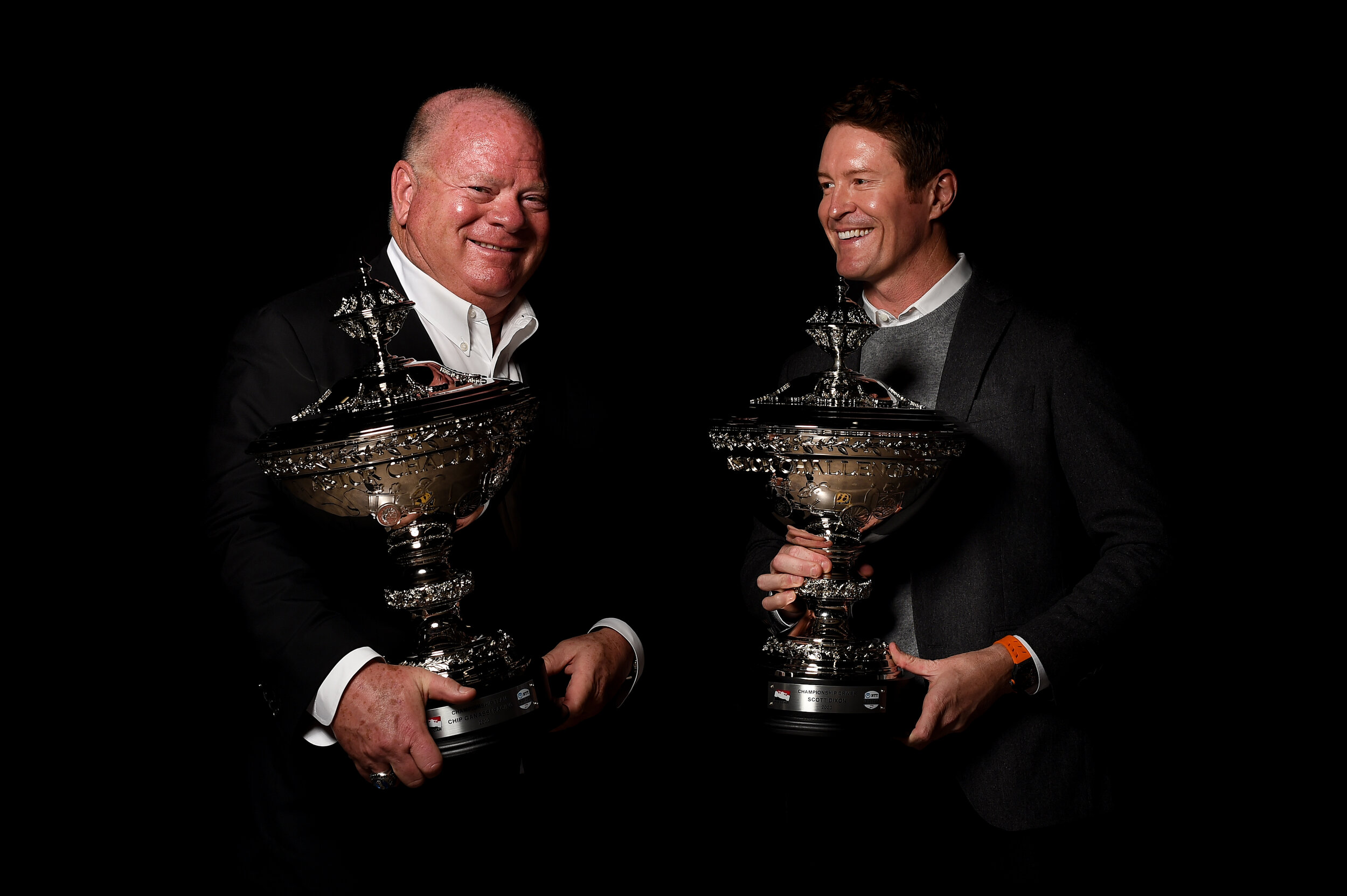  Chip Ganassi and Scott Dixon share a smile after being awarded Astor Cup replicas to commemorate the 2020 IndyCar championship victory.  