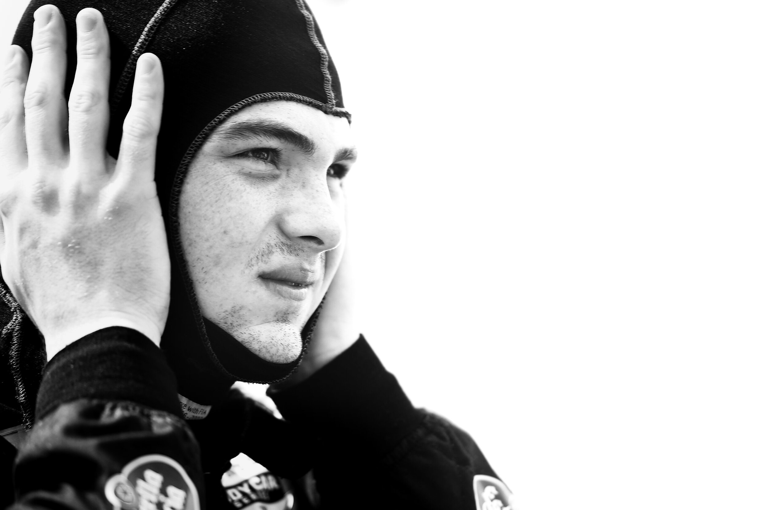  Pato O'ward puts on his Balaclava before practice. This photo is very simple but I enjoy it. I really get a sense of focus from it! 